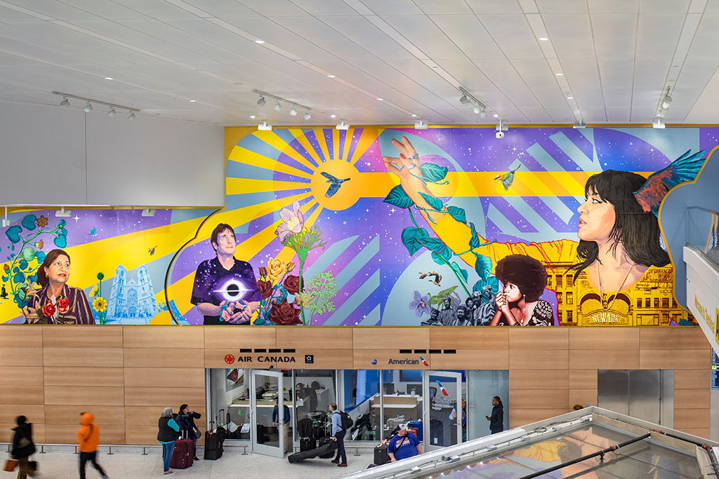 A brightly colored horizontal mural in an airport terminal featuring Newark Airport employees and notable historical icons in the New Jersey region, with a blue...