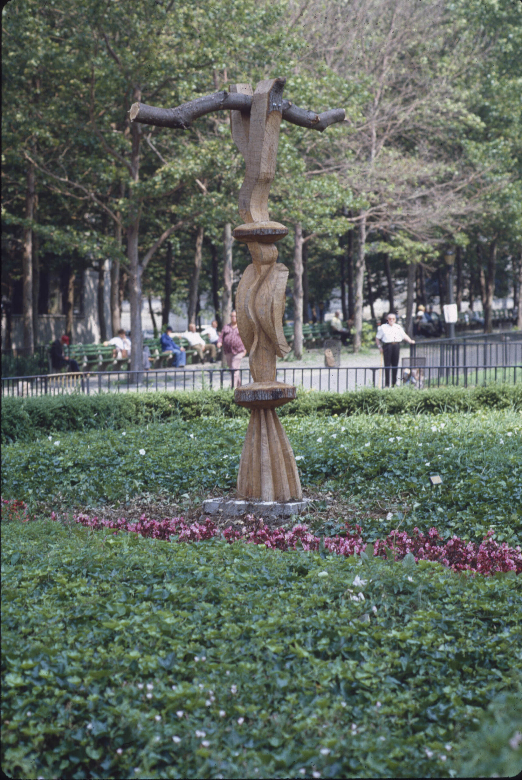 a wooden sculpture in a park