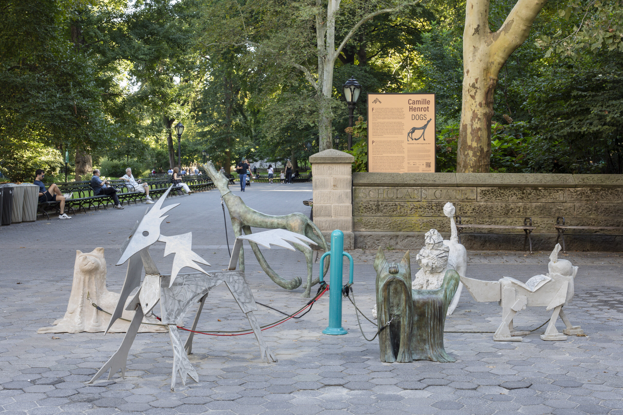 a group of dog sculptures in a plaza
