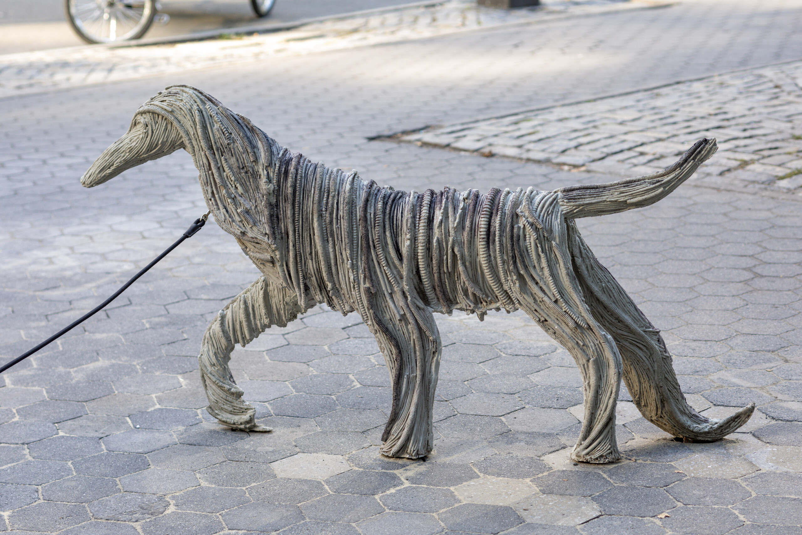 a dog sculpture made of concrete and epoxy